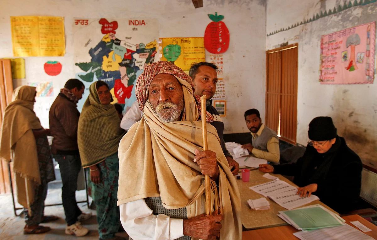A man looks on as he arrives to cast his vote inside a polling station during the state assembly election in the northern state of Punjab, in the village of Nada, India, February 4, 2017. REUTERS/Ajay Verma