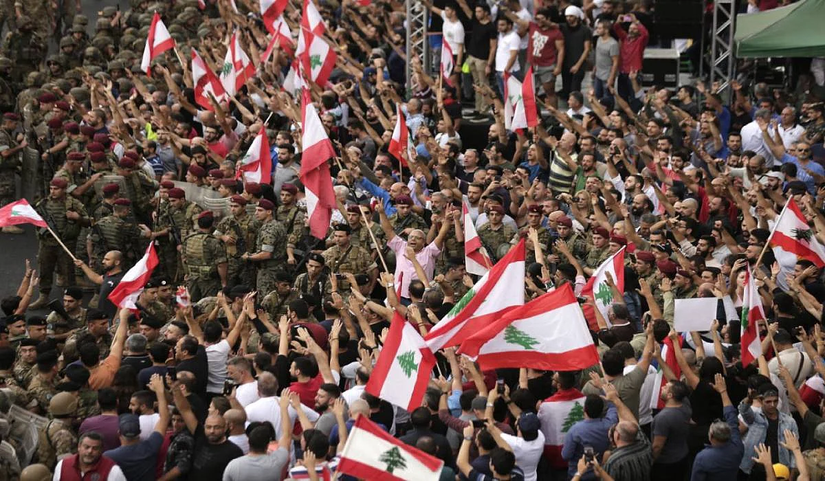 Anti-government protesters shout slogans against the Lebanese government
