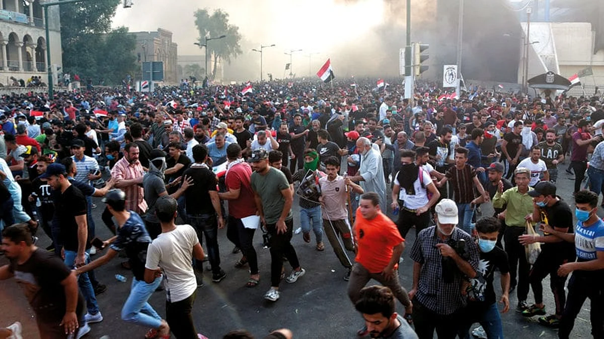 Protesters march towards Baghdad’s fortified Green Zone as anti-government protests resume