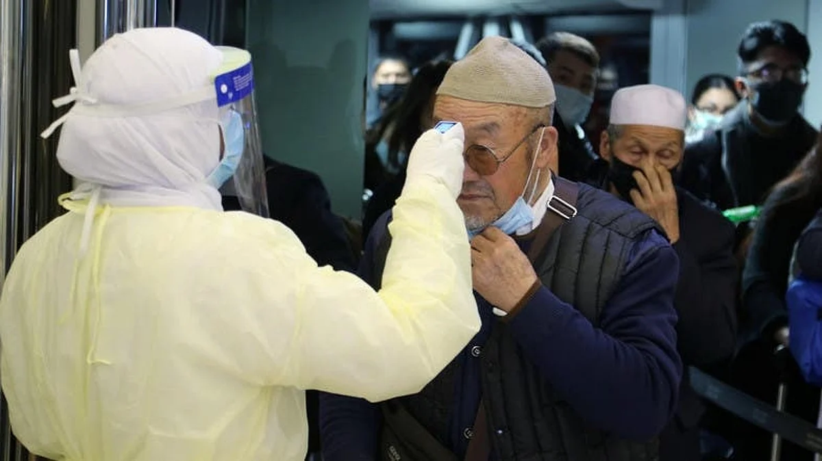 Passengers coming from China wearing masks to prevent coronavirus infection are checked by Saudi Health Ministry employees upon their arrival at King Khalid International Airport, in Riyadh, Saudi Arabia, January 29, 2020.