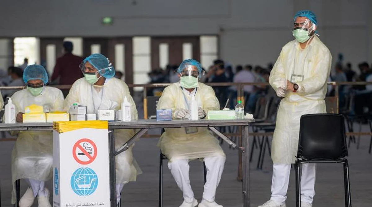 Nurses await to admit expatriates in a makeshift coronavirus testing center at the Mishref Fair Grounds in Kuwait city, Kuwait March 12, 2020. REUTERS/Stephanie McGehee