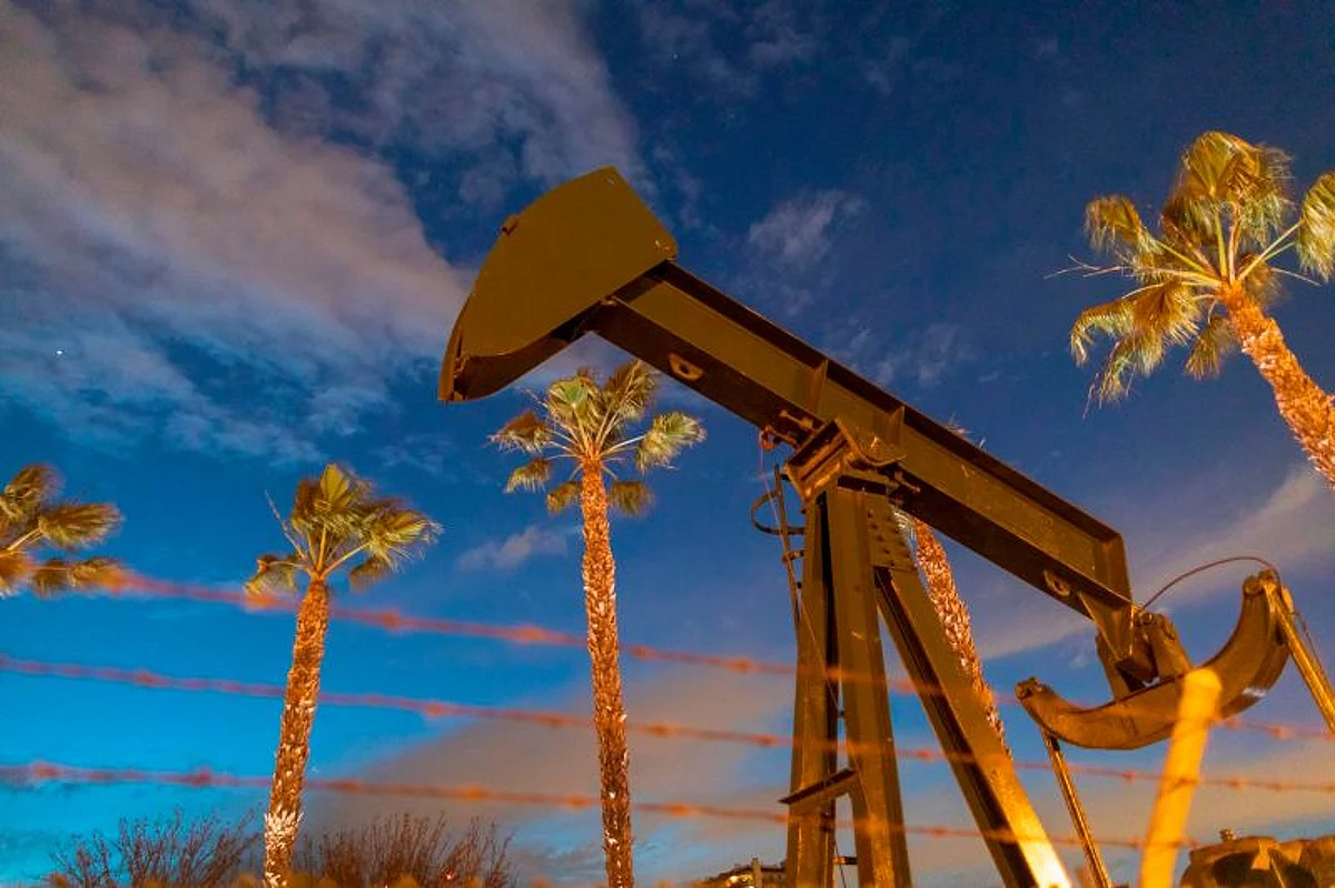 Pump jacks draw crude oil from the Long Beach Oil Field under Discovery Well Park in Signal Hill, California, on March 9, 2020.
