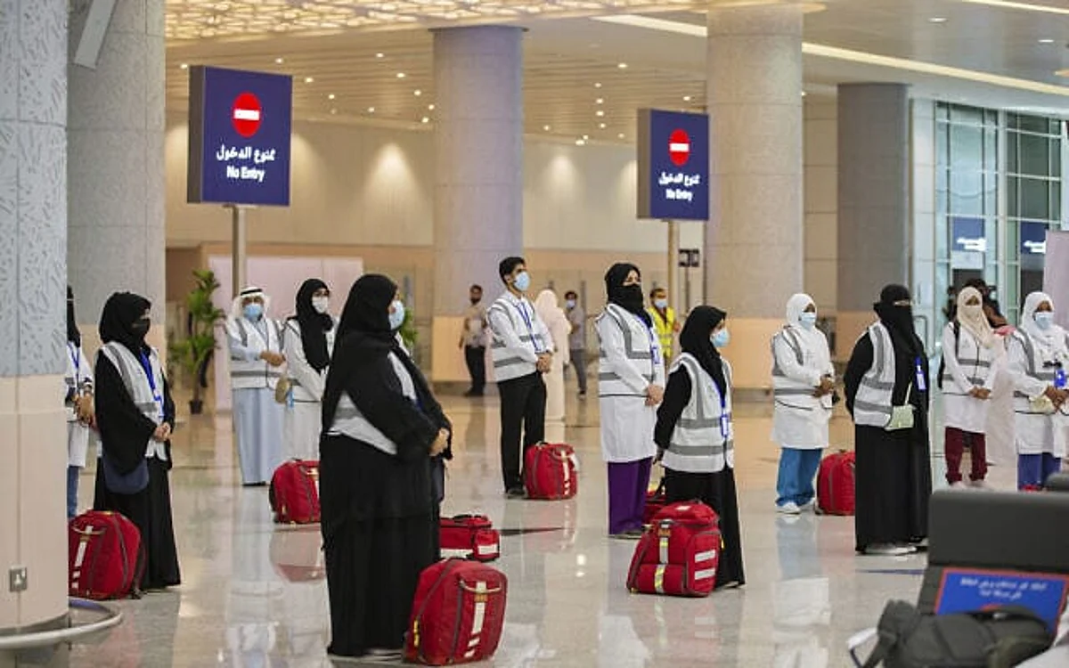 Pilgrims arrive to King Abdulaziz Airport for the Hajj pilgrimage to Mecca, in Jeddah, Saudi Arabia, Saturday, July 25, 2020. (Saudi Ministry of Media via AP)