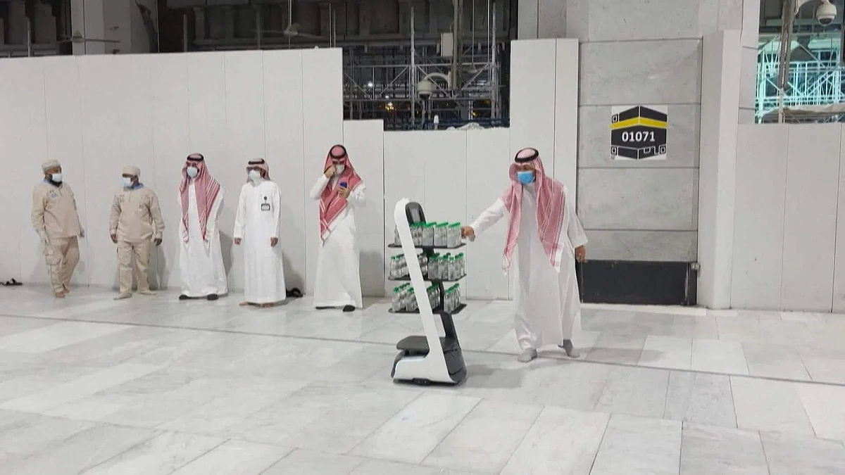 Robots distributing Zamzam water among the many robots that serve pilgrims and work on sterilization and other services