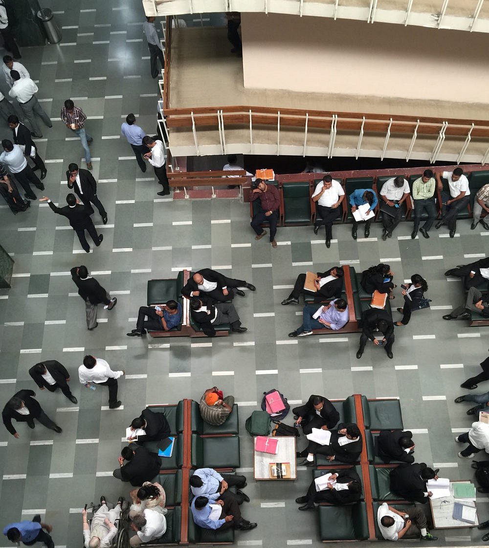 Clients and lawyers waiting in the Delhi High Court 