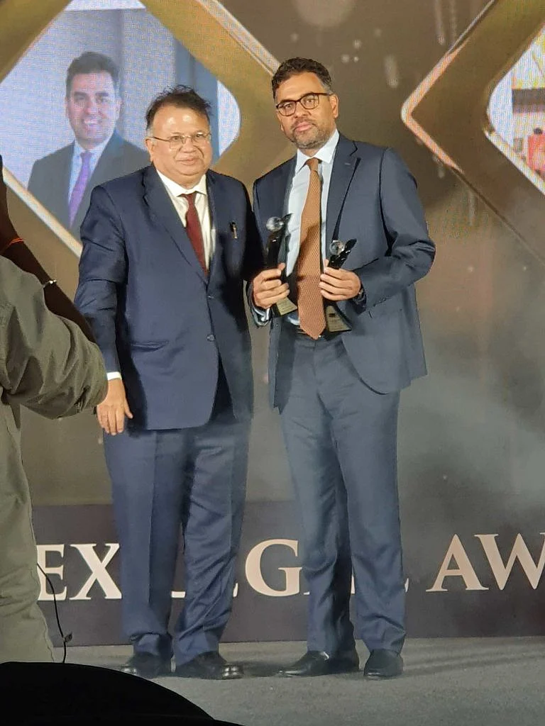 Akshay Chudasama receiving the award for Managing Partner of the Year from Justice AP Shah