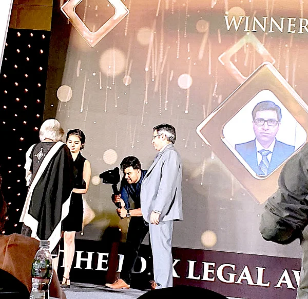 Sameer Chugh, Bharti Airtel collects the award from Senior Advocate Indira Jaising