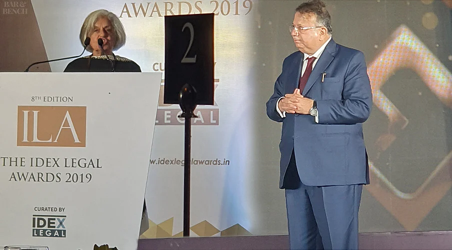 Justice AP Shah looks on while Indira Jaising speaks at the Awards ceremony