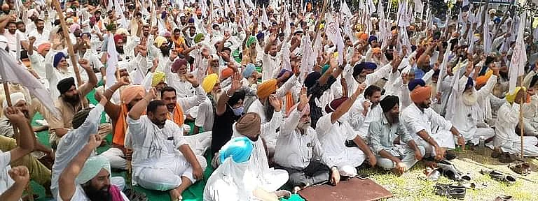 Farmers in Punjab staging a protest against the Farm Bills