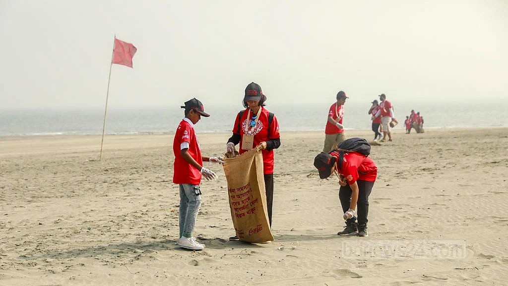Volunteers take part in a clean-up drive as part of the International Coastal Cleanup campaign on St Martin's Island on Friday, Dec 16, 2022.