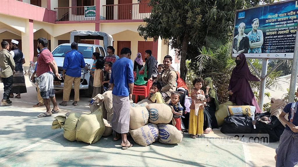 Rohingya families in a temporary shelter in Bandarban are packing their belongings before being relocated to a transit camp in Cox's Bazar's Ukhiya Upazila on Sunday, Feb 5, 2023.  