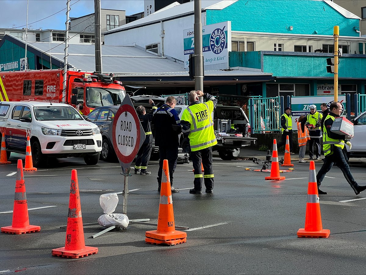 Fire and emergency crews work at the scene of a fire at the Loafers Lodge, in Wellington, New Zealand May 16, 2023.