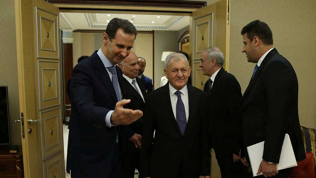 Iraqi President Abdul Latif Rashid meets with Syria's President Bashar Al-Assad as they arrive to attend Organisation of Islamic Cooperation (OIC) summit in Riyadh, Saudi Arabia, November 11, 2023. 