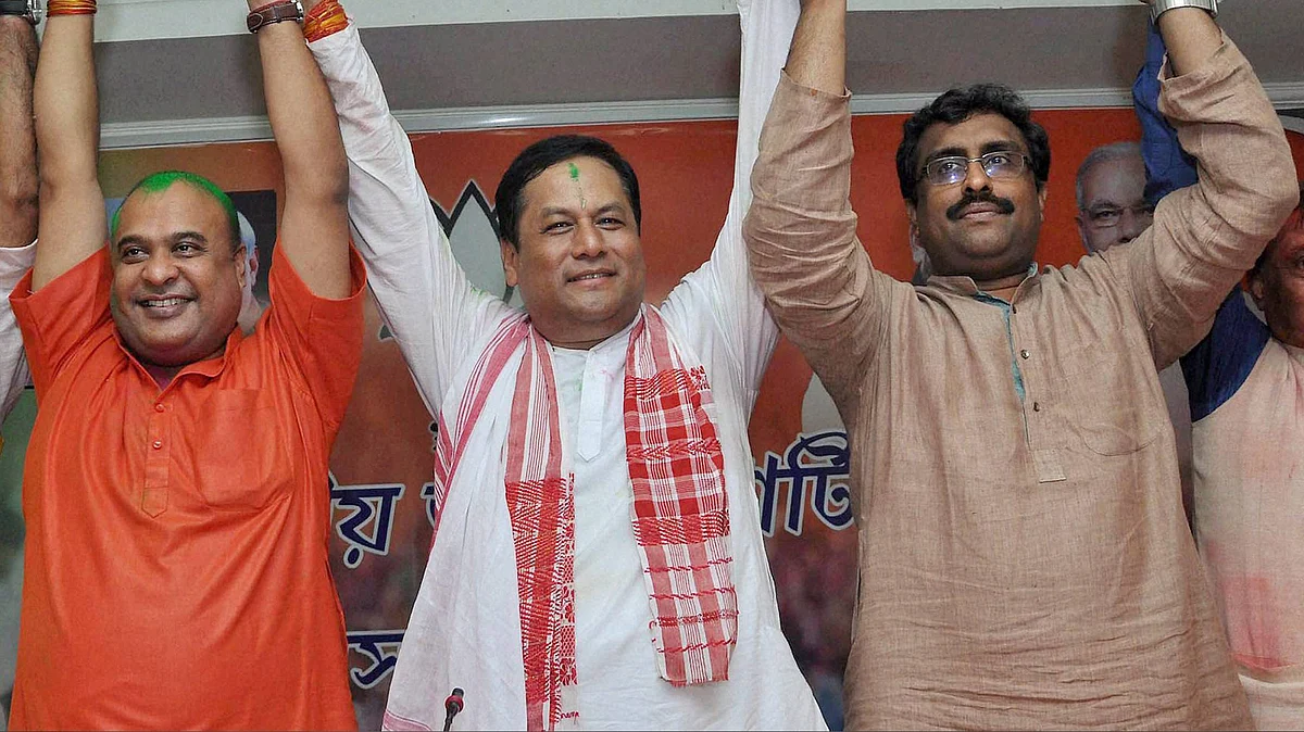 BJP chief ministerial candidate Sarbananda Sonowal (centre) along with Senior BJP leaders Ram Madhav (right) and Himanta Biswa Sarma (left) celebrating the party’s thumping win the Assam Assembly polls at BJP Party head office in Guwahati on Thursday. (Photo: PTI)