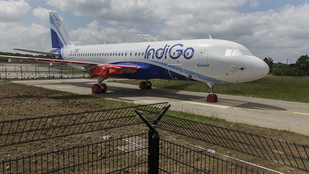 A protective cover sits on a wing engine fitting of an undelivered Airbus Group SE A320neo passenger jet, operated by IndiGo (Photographer: Balint Porneczi/Bloomberg)