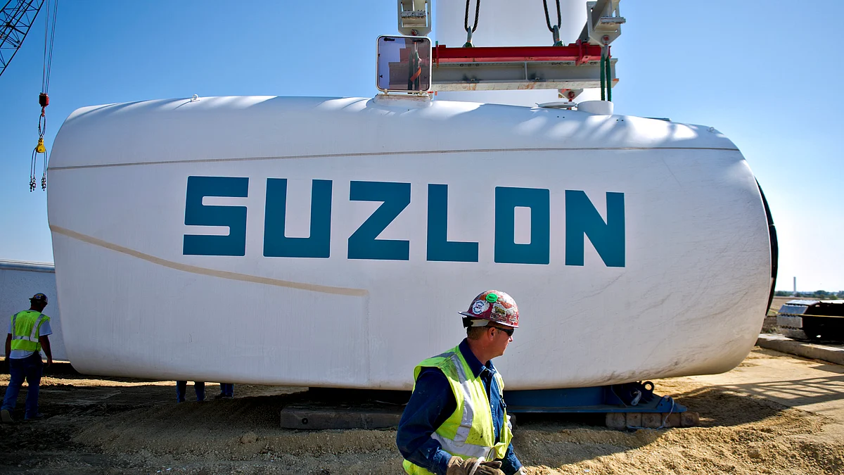 A nacelle containing a Suzlon Energy Ltd. turbine is prepared to be raised during the construction of a wind turbine at the Edison Mission Group Big Sky wind farm in Ohio, Illinois, U.S. (Photographer: Daniel Acker/Bloomberg)