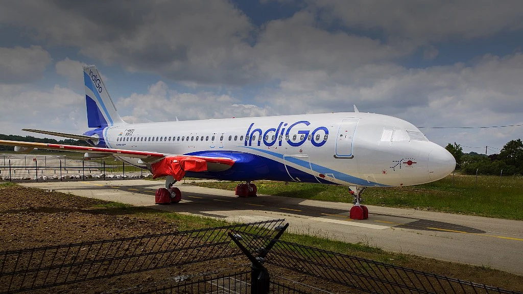 A protective cover sits on a wing engine fitting of an undelivered Airbus Group SE A320neo passenger jet, operated by IndiGo, a unit of Interglobe Enterprises Ltd., as it stands on the tarmac at Toulouse-Blagnac airport in Toulouse, France. (Photographer: Balint Porneczi/Bloomberg) 