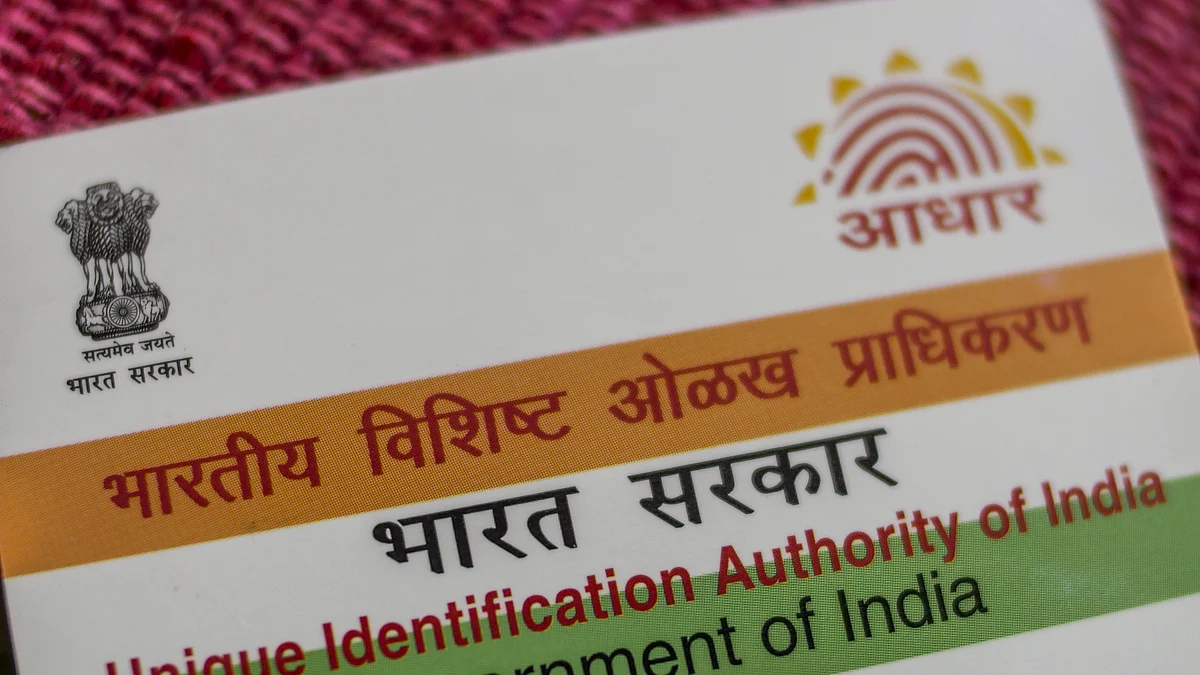 An Aadhaar biometric identity card, issued by the Unique Identification Authority of India. (Photographer: Dhiraj Singh/Bloomberg)