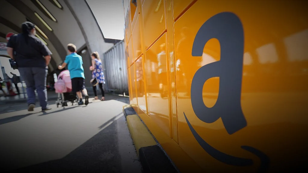 The Amazon logo sits on an Amazon.com Inc. pickup and collect locker (Photographer: Chris Ratcliffe/Bloomberg)