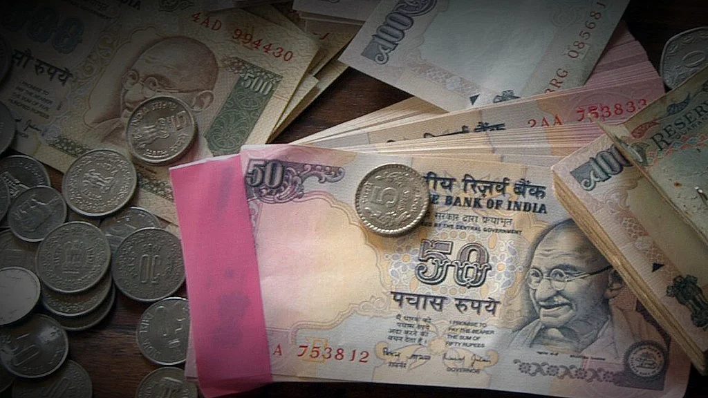 Indian rupee notes and coins displayed in Mumbai, India (Photographer: Santosh Verma/ BloombergNews)