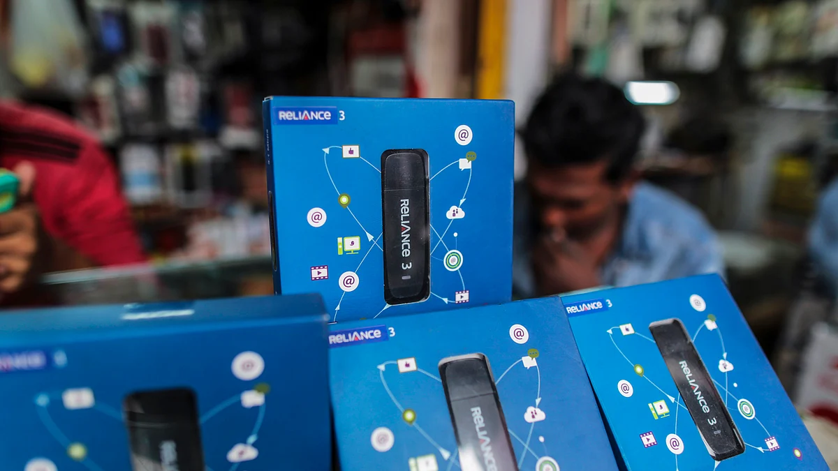 Packaging for Reliance Communications Ltd. internet dongles sit on display at a mobile phone store in Mumbai, India (Photographer: Dhiraj Singh/Bloomberg)