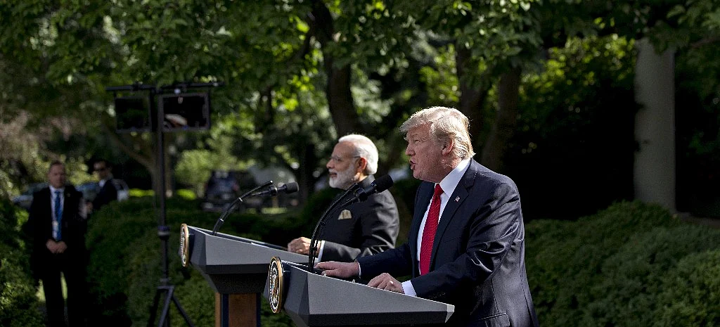 U.S. President Donald Trump, right, speaks as Narendra Modi, India’s prime minister, listens during a joint statement in the Rose Garden of the White House in Washington, D.C., on June 26, 2017. (Photographer: Andrew Harrer/Bloomberg)