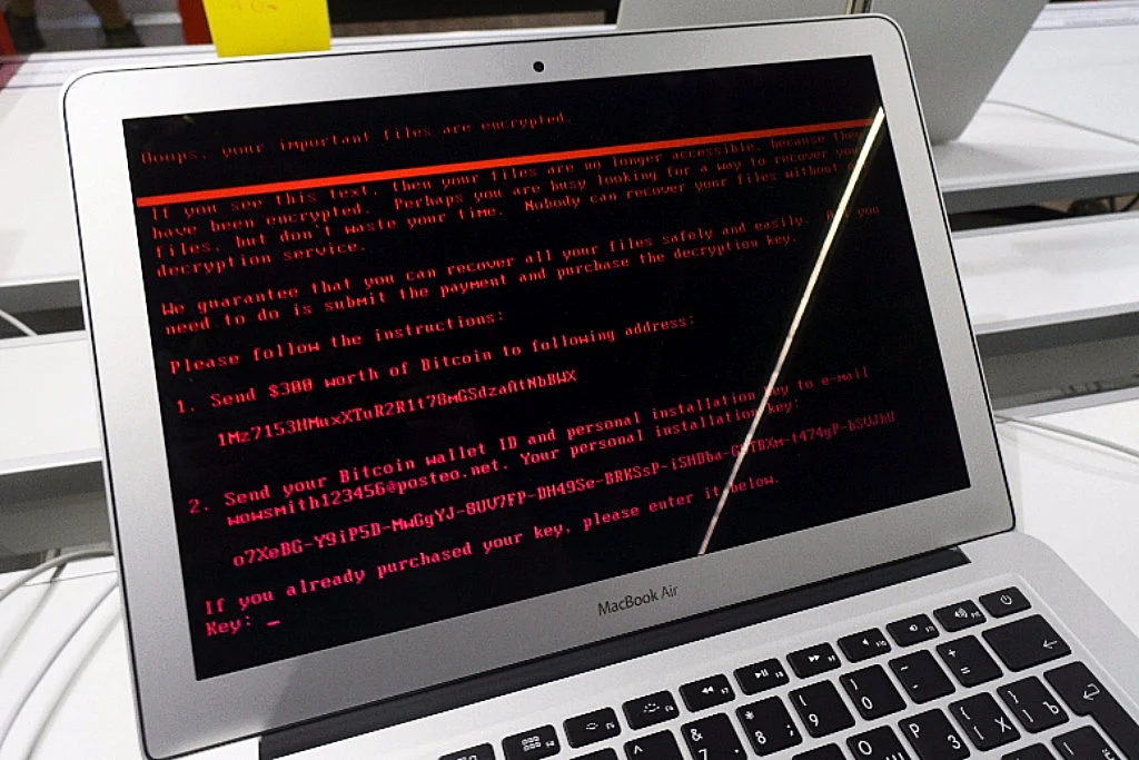 A ransomware demand sits on the screen of an Apple Inc. Macbook Air laptop infected by the ‘Petya’ computer virus inside an electronics store in Kiev, Ukraine ((Photographer: Vincent Mundy/Bloomberg) 