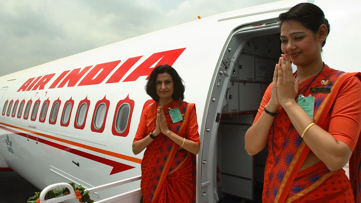 Staff of Air India flight A321 at Indira Gandhi International Airport in New Delhi, India (Photographer: Pankaj Nangia/Bloomberg News