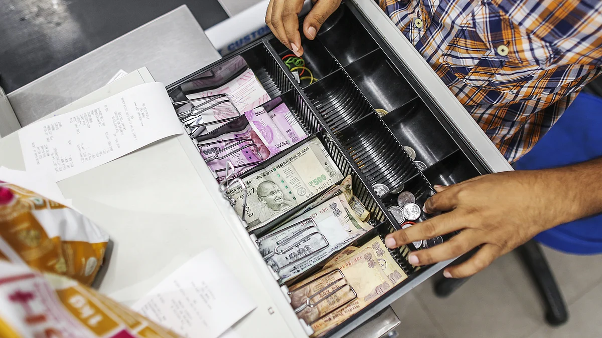 Indian rupee banknotes of various denominations sit in a cash register at a hypermarket in Mumbai, India. (Photographer: Dhiraj Singh/Bloomberg)