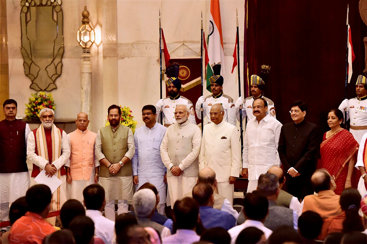 President Ram Nath Kovind, Vice President M. Venkaiah Naidu, Prime Minister Narendra Modi poses with some new members of cabinet after the reshuffle at Rashtrapati Bhavan in New Delhi on Sunday. (Photographer: Kamal Kishore/PTI)