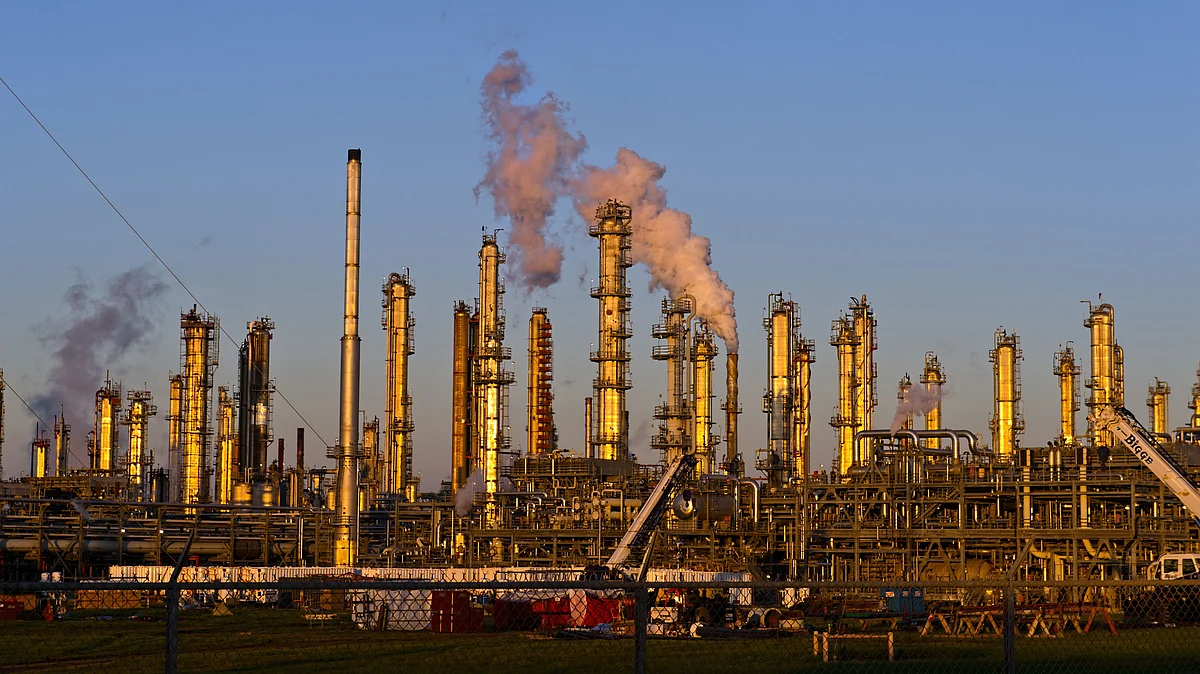 View of an oil refinery in operation. (Photographer: Eddie Seal/Bloomberg)