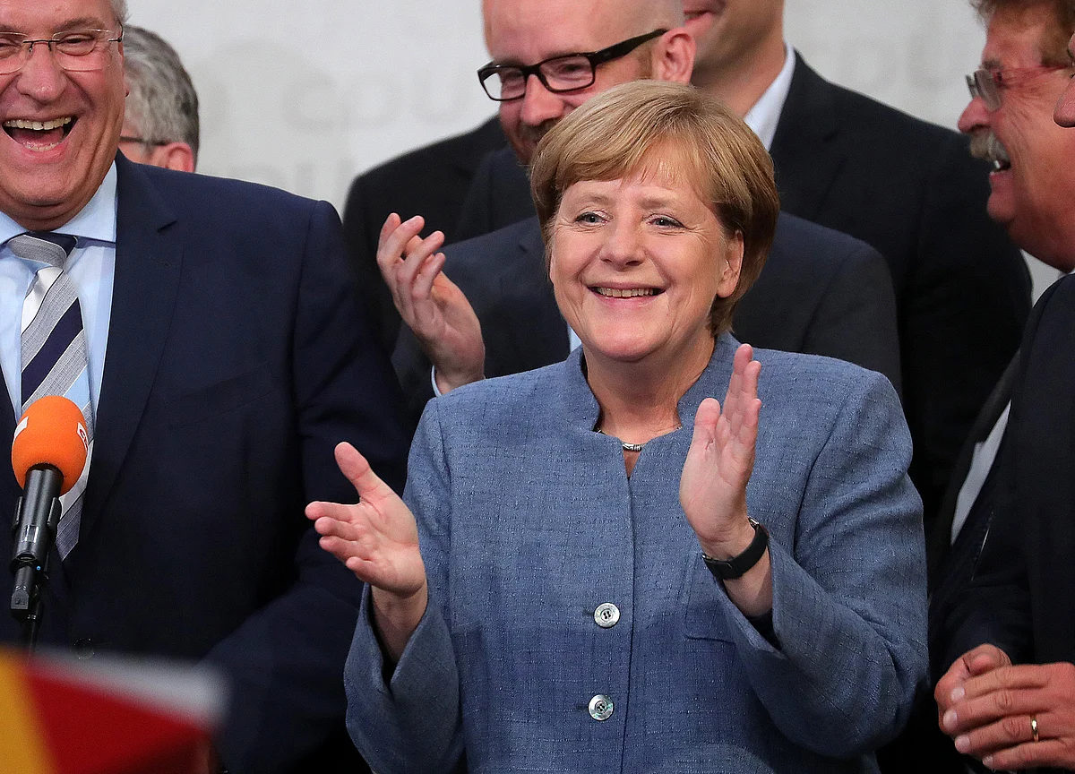 Macron Says He Would Back Merkel for EU Post ‘If She Wants It’