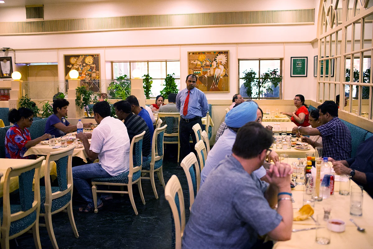 Customers eat and drink at a restaurant in Jaipur, Rajasthan, India. (Photographer: Udit Kulshrestha/Bloomberg)