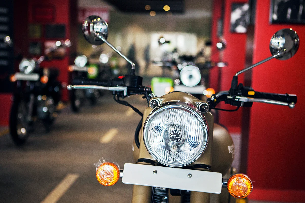 An Eicher Motors Ltd. Royal Enfield Desert Storm motorcycle stands on display at the company’s Royal Enfield flagship dealership in Gurgaon, India (Photographer: Prashanth Vishwanathan/Bloomberg) 