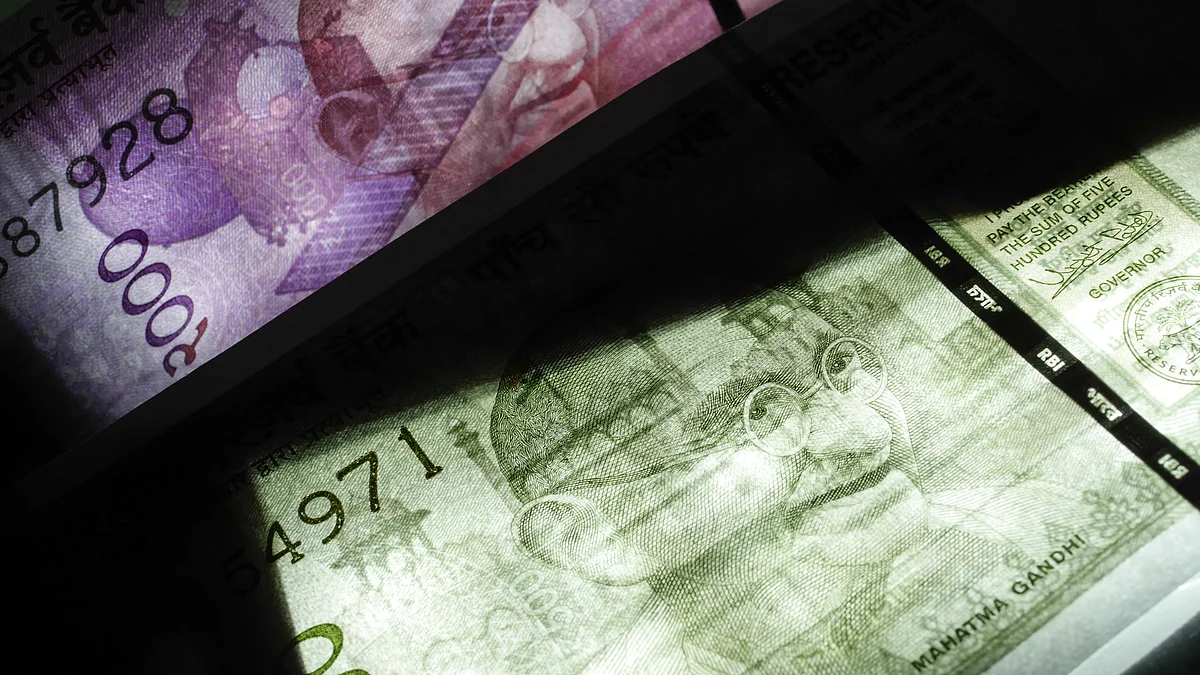 Indian two thousand and five hundred rupee banknotes are arranged for a photograph in Mumbai, India. (Photographer: Dhiraj Singh/Bloomberg)