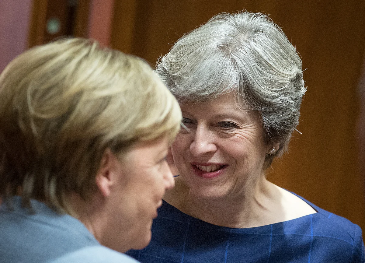 Merkel Said to Be Wary of Hurting May as Her Ally Backs U.K.
