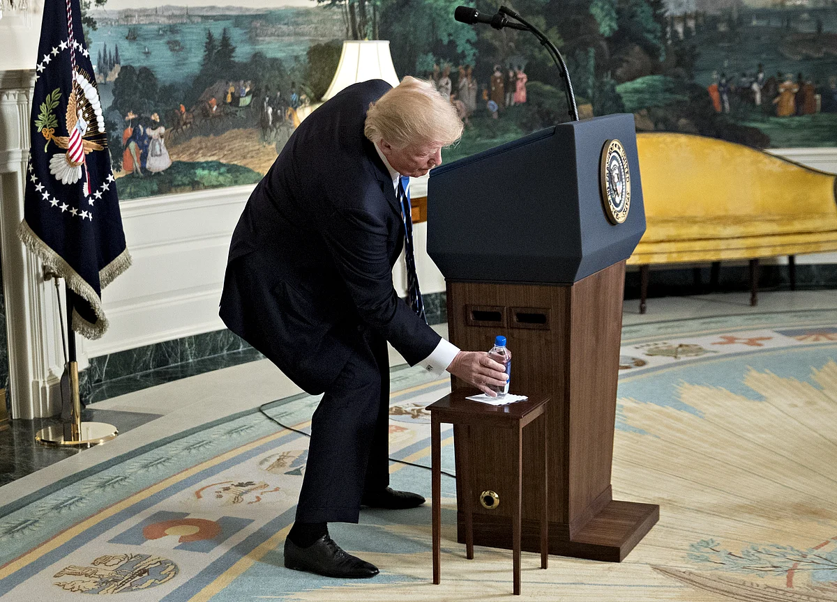 Trump's Water-Bottle Fumble Steals Show From Asia Travelogue