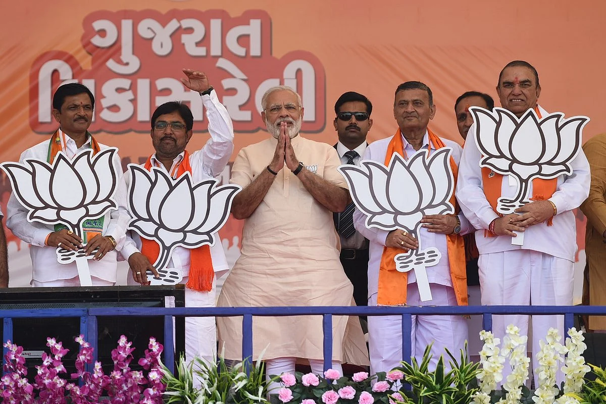 Prime Minister, Narendra Modi greets during a rally, ahead of elections in Gujarat. (Source: Official Twitter Handle of Narendra Modi)