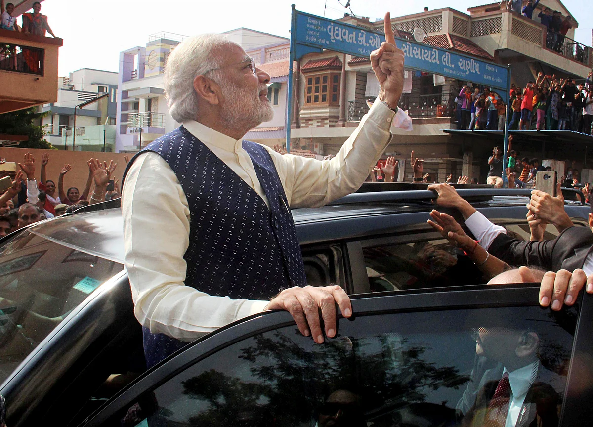 Modi Stands In Queue To Cast Vote; Election Commission Orders Inquiry On Congress’ Complaint