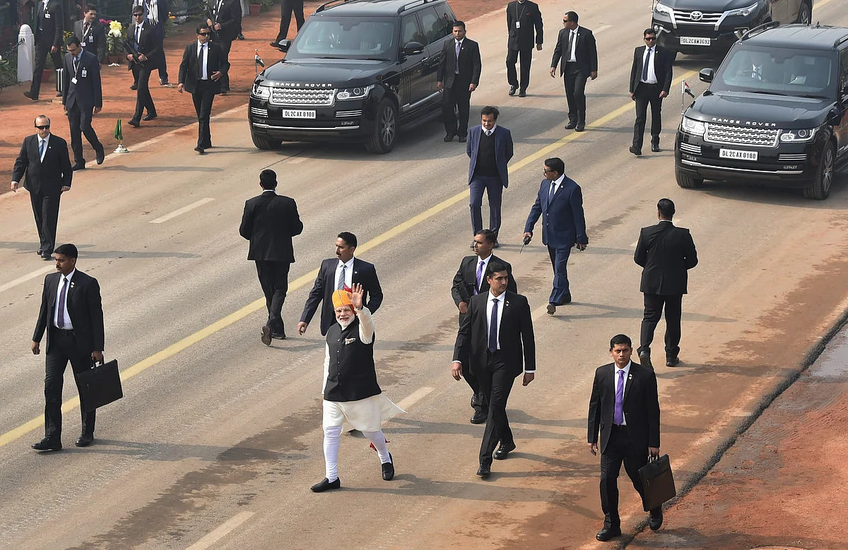 Prime Minister Narendra Modi waves at the crowd during the 69th Republic Day Parade at Rajpath. (Image: PTI)