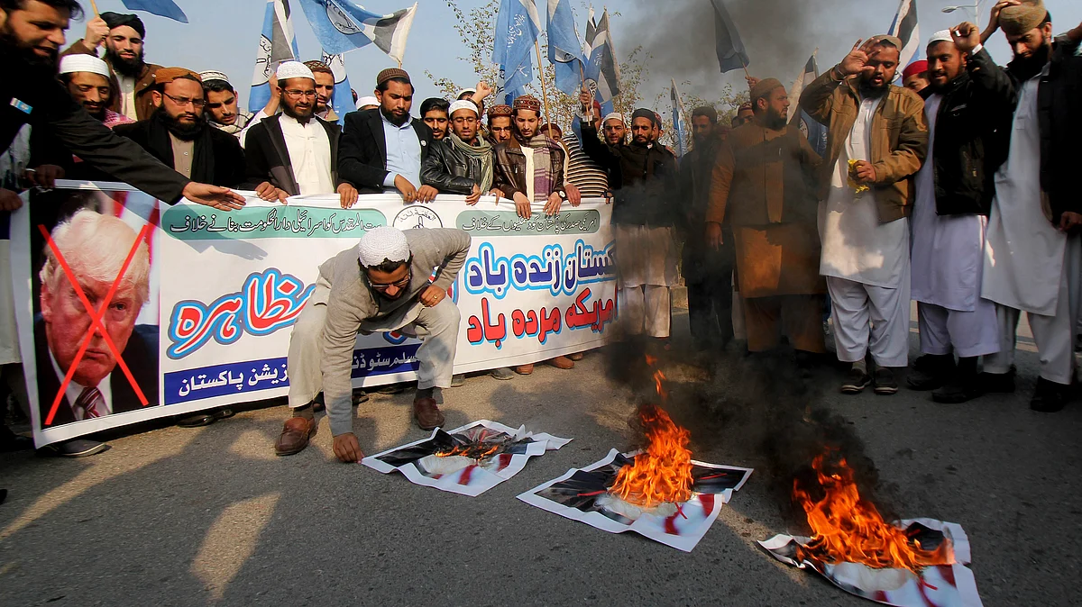 Pakistani students protest against U.S. President Donald Trump in Islamabad, Pakistan, holding a banner reads “long live Pakistan, down with America,” on January 5, 2018. (Photograph: AP/PTI)
