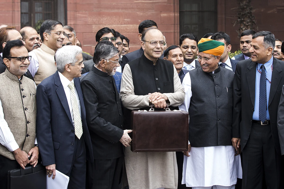 Arun Jaitley, India’s finance minister, center left, and other members of the finance ministry stand for a photograph outside the North Block of the Central Secretariat building before leaving to table the budget in parliament in New Delhi. (Photographer: Udit Kulshrestha/Bloomberg)