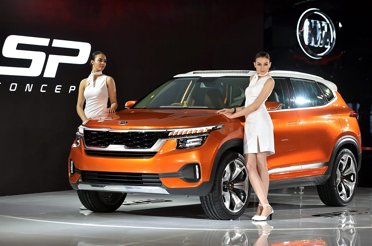 Models showcase a Kia Motors Corporation’s SP Concept car at the Auto Expo 2018 in Greater Noida on Wednesday. (Source: PTI)