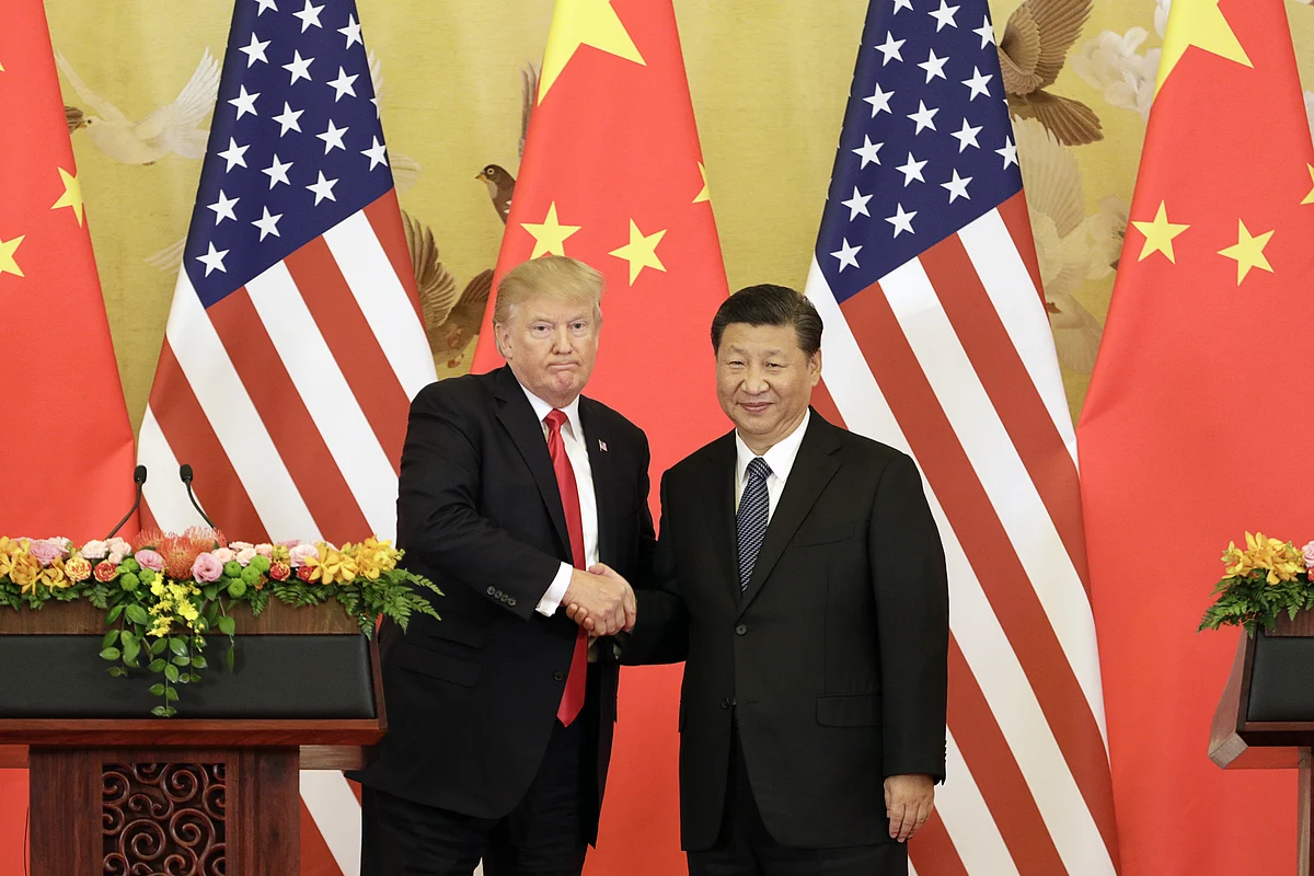 FILE: U.S. President Donald Trump, left, and Xi Jinping, China’s president, shake hands during a news conference in Beijing, China, on Nov. 9, 2017. (Photographer: Qilai Shen/Bloomberg)