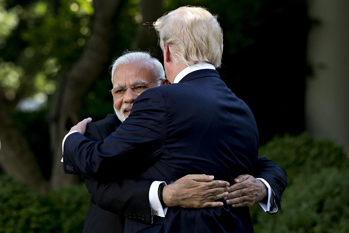 Narendra Modi, India’s prime minister, left, hugs U.S. President Donald Trump during a joint statement in the White House in Washington, D.C., U.S., on June 26, 2017. (Photographer: Andrew Harrer/Bloomberg)