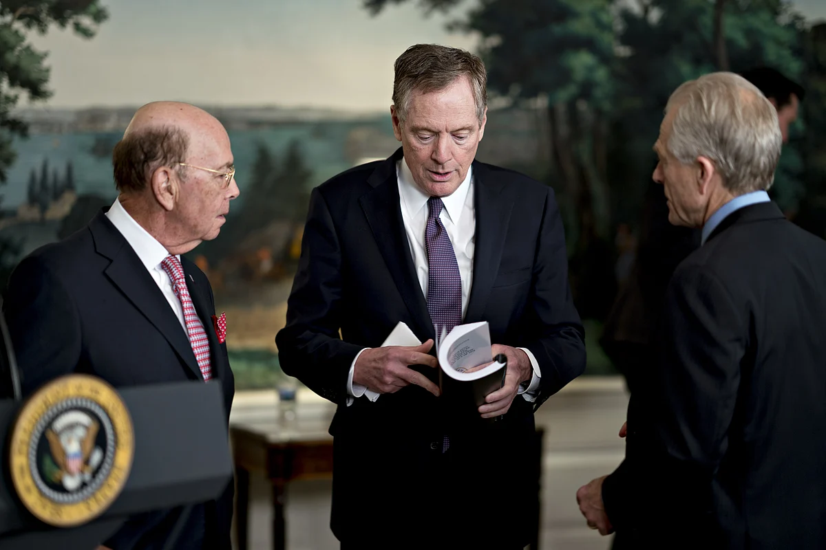 Peter Navarro, director of the National Trade Council, from right, Robert Lighthizer, U.S. trade representative, and Wilbur Ross, U.S. commerce secretary, speak before U.S. President Donald Trump, not pictured, signs a presidential memorandum targeting China’s economic aggression in the Diplomatic Room of the White House in Washington, D.C., U.S., on March 22, 2018. (Photographer: Andrew Harrer/Bloomberg)