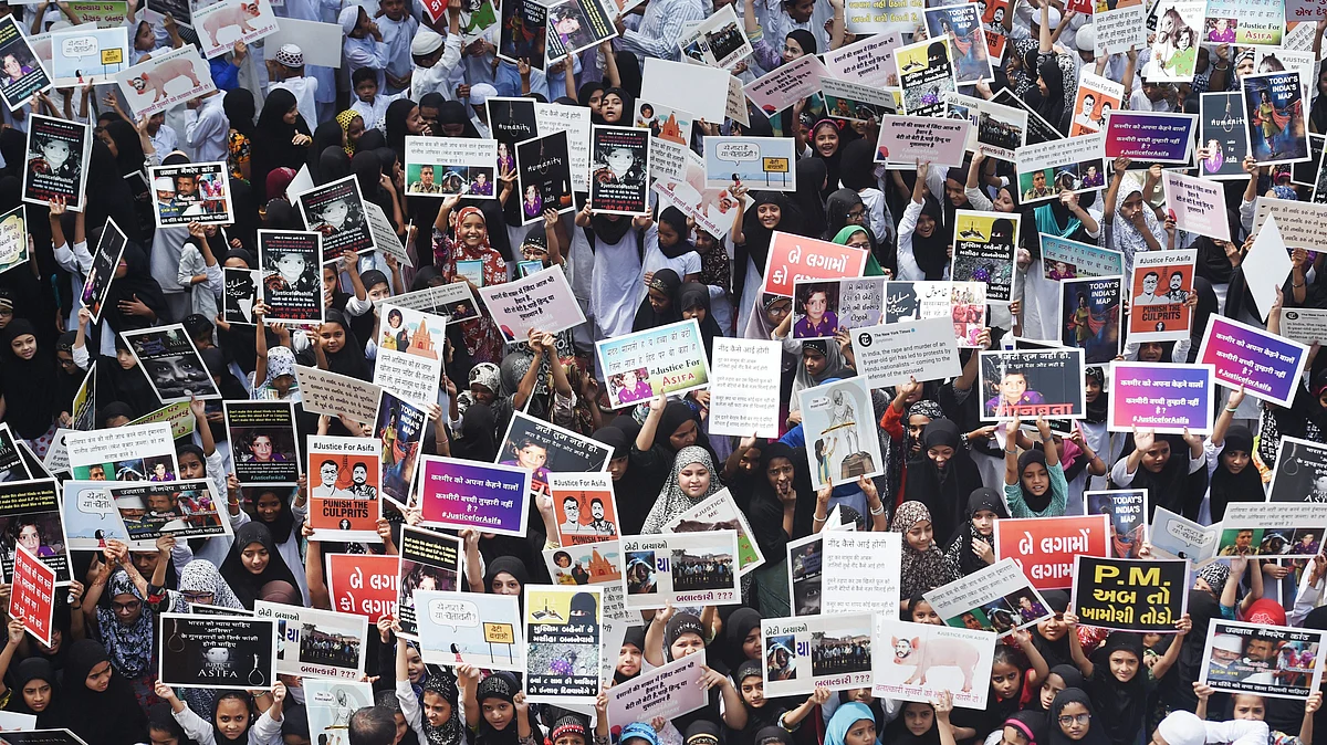 Students display placards as they protest over government’s alleged ‘inaction’ in Kathua and Unnao rape cases, in Ahmedabad on April 15, 2018. (Photograph: Santosh Hirlekar/PTI)
