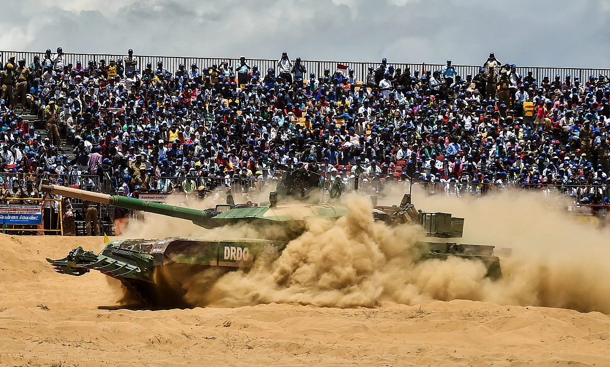 An Indian Arjun Mark II tank drives through the sand during a live demo for the public. (Source: PTI)