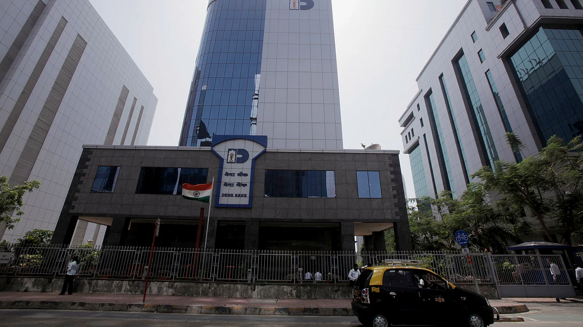 A taxi stands parked in front of the Dena Bank building in Mumbai. (Bloomberg. Photographer: Adeel Halim/Bloomberg)