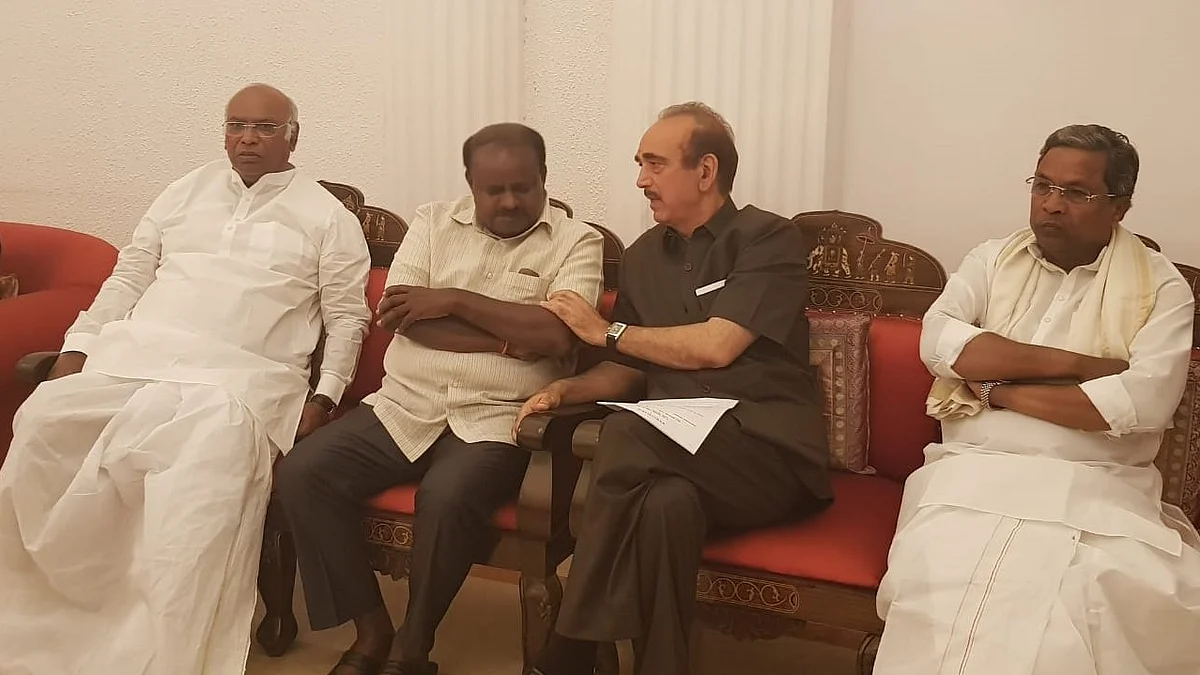 Congress Leaders Mallikarjun Kharge, Ghulam Nabi Azad, Siddaramaiah with JD(S) President HD Kumaraswamy, second from left, at the Raj Bhavan in Bengaluru, on May 15, 2018. (Photograph: ANI)